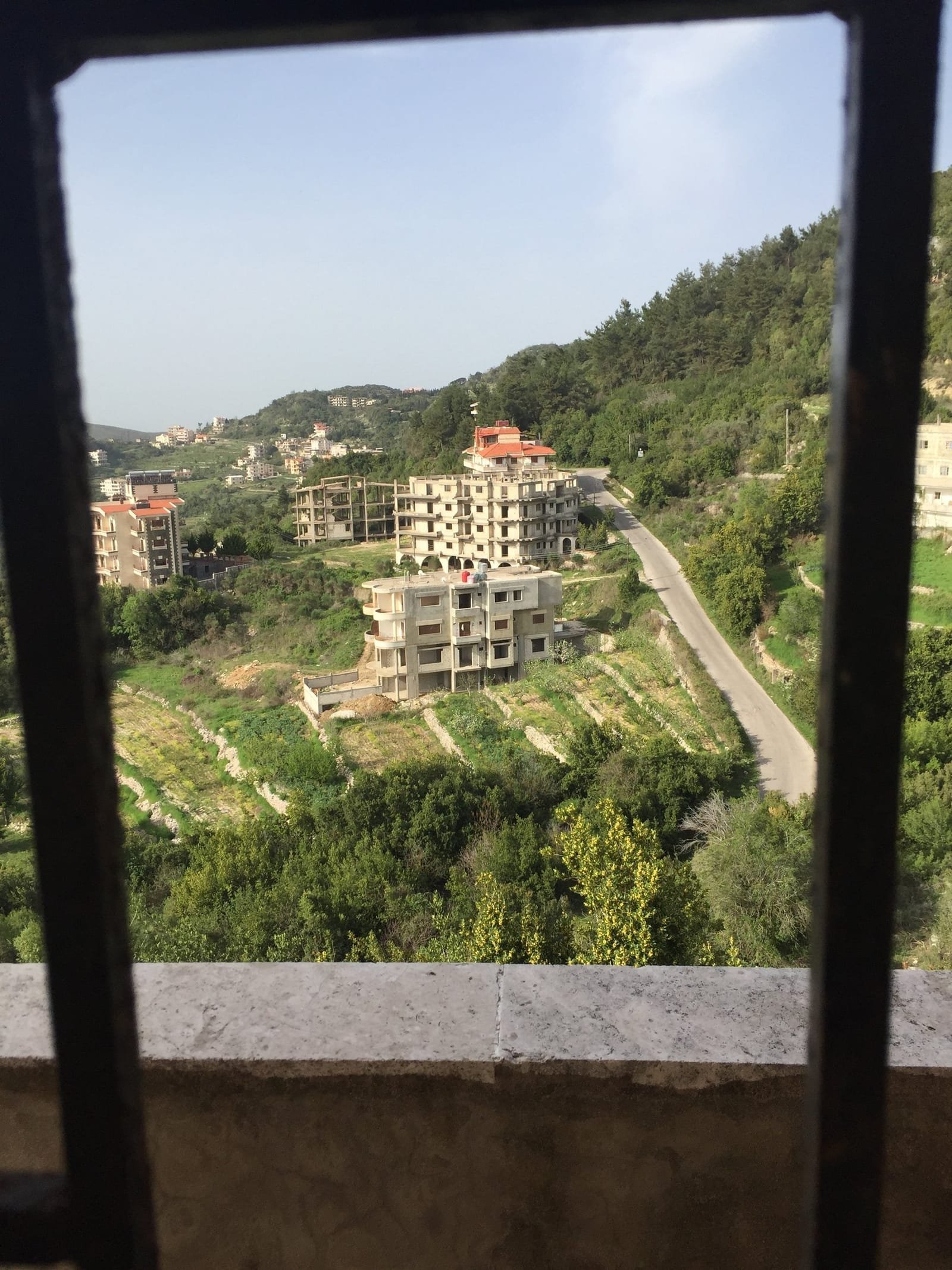 The valley seen through an unfinished window opening on the parcel